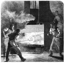 Manufacture of the Armstrong Gun at Woolwich Arsenal: welding the coil, 1862. Creator: W Thomas