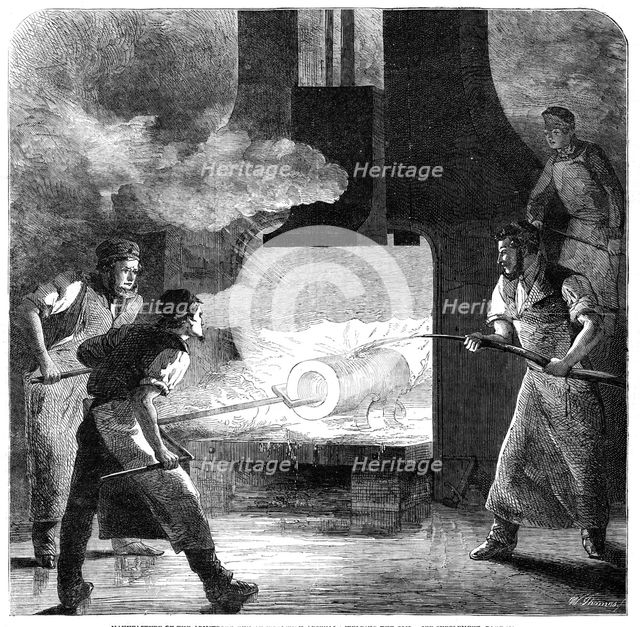Manufacture of the Armstrong Gun at Woolwich Arsenal: welding the coil, 1862. Creator: W Thomas.