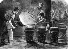 Manufacture of the Armstrong Gun at Woolwich Arsenal: casting the shot and shell for 100..., 1862. Creator: W Thomas