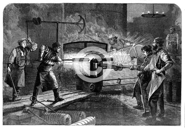 Manufacture of the Armstrong Gun at Woolwich Arsenal: coiling the bars, 1862. Creator: Unknown.