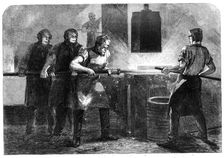 Manufacture of the Armstrong Gun at Woolwich Arsenal: drawing down and welding the..., 1862. Creator: W Thomas