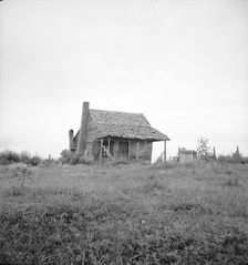 Many cabins of this type are found on the Mississippi Delta, 1936. Creator: Dorothea Lange