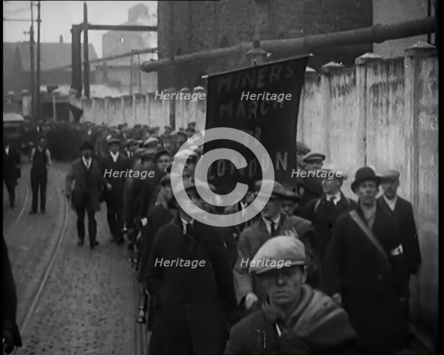 Marchers Carrying a Banner Which Reads: 'Miners March to London', 1931. Creator: British Pathe Ltd.
