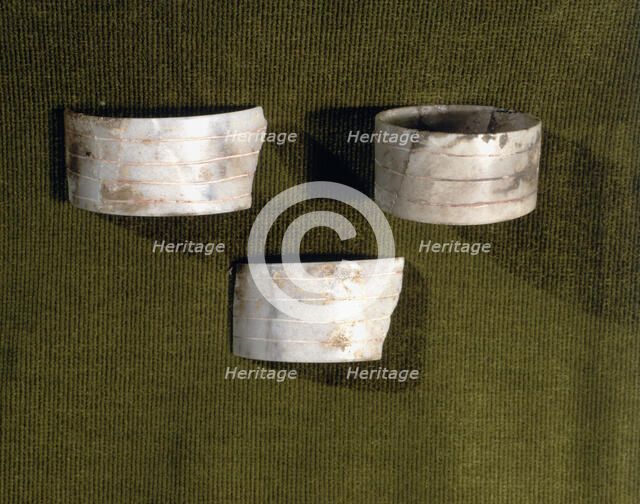Marble bracelets decorated with parallel carved lines, from the Bat Cave, Zuheros (Córdoba).