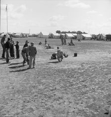 Marble time in FSA migratory labor camp, near Calipatria, Imperial Valley, CA, 1939. Creator: Dorothea Lange