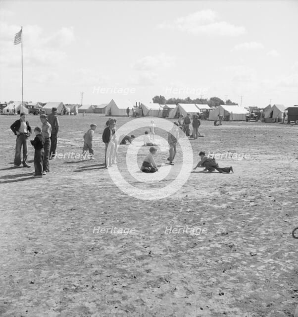 Marble time in FSA migratory labor camp, near Calipatria, Imperial Valley, CA, 1939. Creator: Dorothea Lange.
