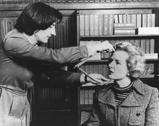 Margaret Thatcher being measured by Jean Fraser at Madame Tussauds, London, 10th April 1985