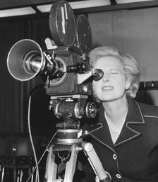 Margaret Thatcher looking through a BBC camera at Heathrow Airport, 6th September 1976