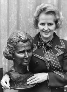 Margaret Thatcher pictured with a bronze bust at the House of Commons, 12th November 1975