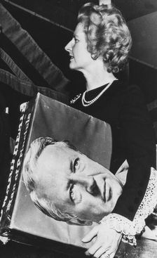 Margaret Thatcher with a picture of Ted Heath under her arm, Dudley, 31st January 1975