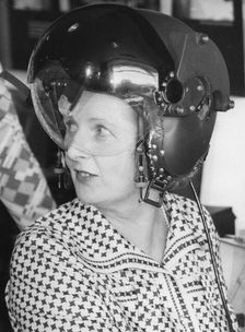 Margaret Thatcher trying on a pilot's helmet, Marconi Avionics Airport Works, 21st August 1978