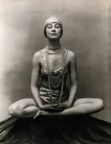 Marguerite Agniel posing with her legs crossed and hands together resting on her legs, 1929. Creator: Unknown