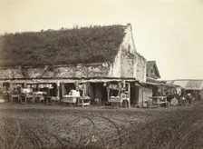 Market stalls beside old powder magazine, Irkutsk, between 1885 and 1886. Creator: Unknown