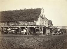 Market stalls beside old powder magazine, Irkutsk, between 1885 and 1886. Creator: Unknown