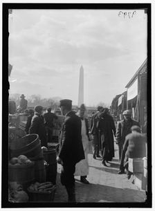 Market; Washington Monument in background, between 1916 and 1918. Creator: Harris & Ewing