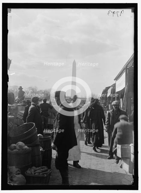 Market; Washington Monument in background, between 1916 and 1918. Creator: Harris & Ewing.