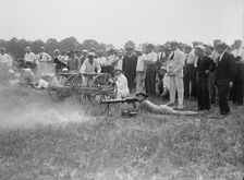 Marine Corps Rifle Range, Winthrop, Md. - Gen. Barnett Testing Colt's Automatic Machine Gun, 1917. Creator: Harris & Ewing