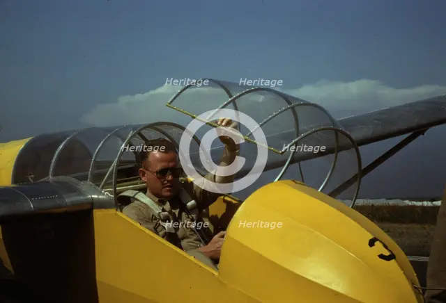 Marine glider pilot in training at Page Field, is watching take-offs, Parris Island, S.C., 1942. Creator: Alfred T Palmer.