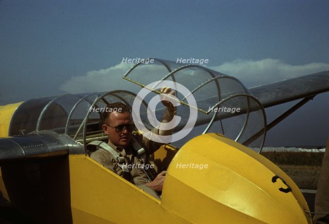 Marine glider pilot in training at Page Field, is watching take-offs, Parris Island, S.C., 1942. Creator: Alfred T Palmer.