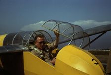 Marine glider pilot in training at Page Field, is watching take-offs, Parris Island, S.C., 1942. Creator: Alfred T Palmer