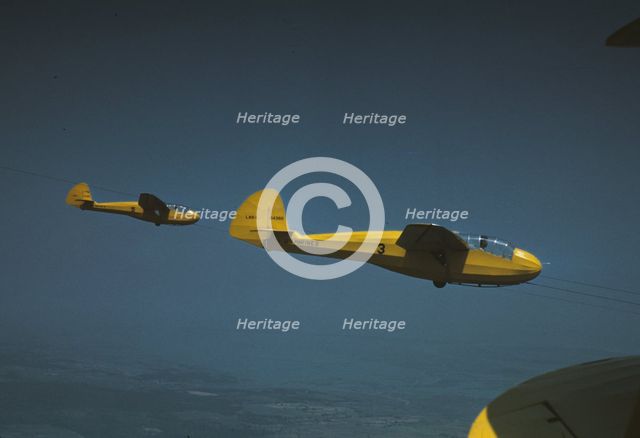Marine gliders being towed from Page Field, Parris Island, S.C., 1942. Creator: Alfred T Palmer.