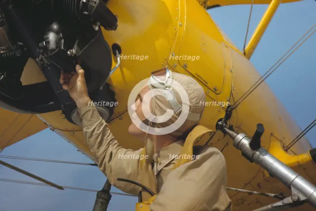 Marine lieutenant by the power towing plane for the gliders at Parris Island, S.C., 1942. Creator: Alfred T Palmer.
