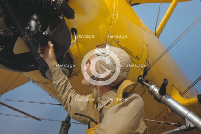 Marine lieutenant by the power towing plane for the gliders at Parris Island, S.C., 1942. Creator: Alfred T Palmer.