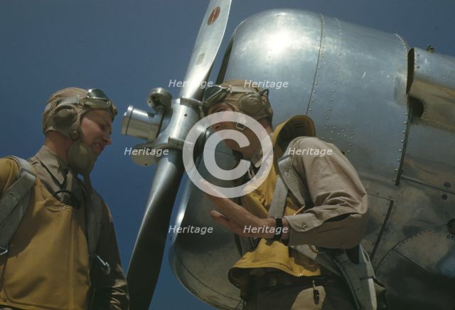 Marine lieutenants, pilots, by the power tow-plane for the...Page Field, Parris Island, S.C., 1942. Creator: Alfred T Palmer.