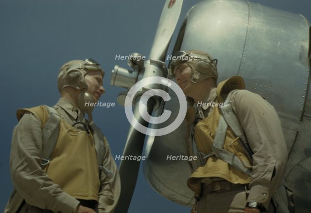 Marine lieutenants, pilots, by the power tow-plane...Parris Island's Page Field, S.C., 1942. Creator: Alfred T Palmer.