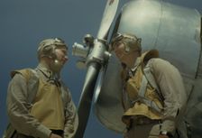 Marine lieutenants, pilots, by the power tow-plane...Parris Island's Page Field, S.C., 1942. Creator: Alfred T Palmer