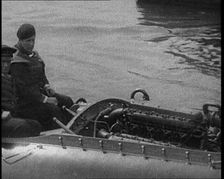 Marion Barbara Joe Carstairs on a Speedboat with a Male Civilian Passenger, 1920. Creator: British Pathe Ltd