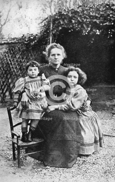 Marie Curie, Polish-born French physicist, with her daughters Eve and Irene, 1908. Creator: Unknown.