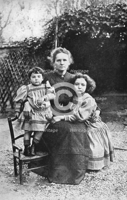 Marie Curie, Polish-born French physicist, with her daughters Eve and Irene, 1908. Artist: Unknown