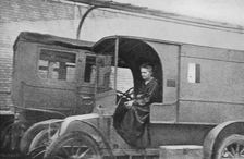 Marie Curie, Polish-born French physicist, driving a car converted into a radiological unit, 1914