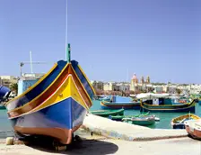 Marsaxlokk harbour, Malta. Creator: Peter Thompson