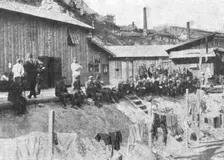 Marseille en Fete; Prisonniers allemands au repos devant leurs baraquements a l'Estaque 1916. Creator: Unknown