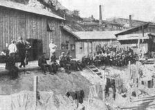 Marseille en Fete; Prisonniers allemands au repos devant leurs baraquements a l'Estaque 1916. Creator: Unknown