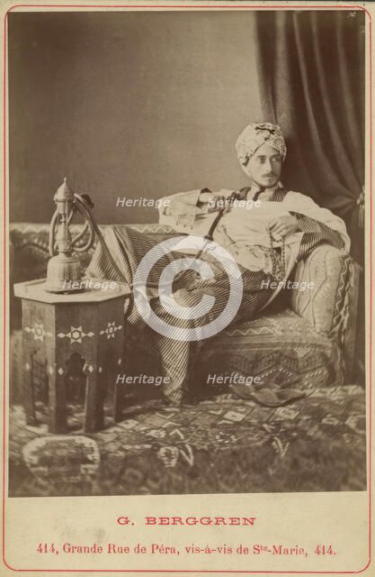 Marquis Claes Lagergren (1853-1930) in eastern costume smoking a hookah. Creator: Guillaume Berggren.