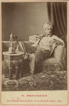 Marquis Claes Lagergren (1853-1930) in eastern costume smoking a hookah. Creator: Guillaume Berggren