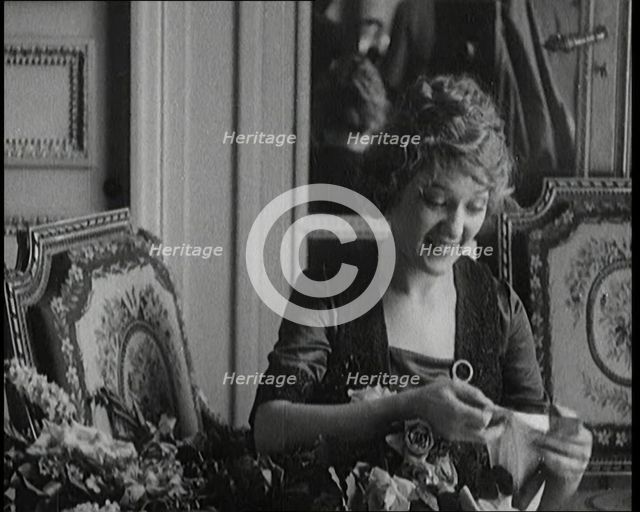 Mary Pickford Talking and Sitting Amongst Flowers in Paris, 1920. Creator: British Pathe Ltd.