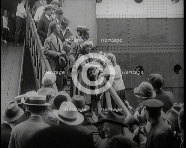 Mary Pickford and Douglas Fairbanks Senior Walking Down the Gangplank to Disembark from an..., 1920. Creator: British Pathe Ltd.