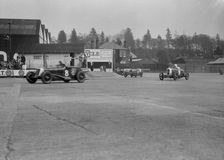 Maserati of Richard Oats leading George Harvey-Noble's Bugatti and a Salmson, Brooklands, 1930s. Artist: Bill Brunell
