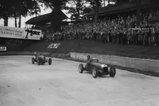 Maserati leading Charles Mortimer's Bugatti Type 35B at Brooklands, Surrey, 1939. Artist: Bill Brunell