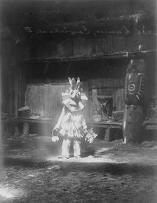 Masked dancer, Cowichan, c1913. Creator: Edward Sheriff Curtis