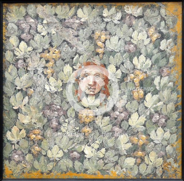 Mask on vine leaves and bunches of grapes, 1st H. 1st cen. AD. Creator: Roman-Pompeian wall painting.