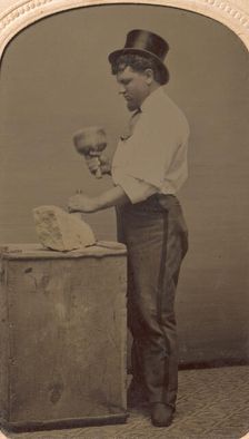 Mason in Top Hat with Mallet, Chisel, and Piece of Stone, 1870s-80s. Creator: J. R. Martin