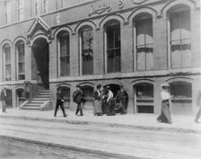 Massachusetts. Lynn. shoe factories, 1895?: sidewalk scene outside Luddy Co., (1895?). Creator: Frances Benjamin Johnston