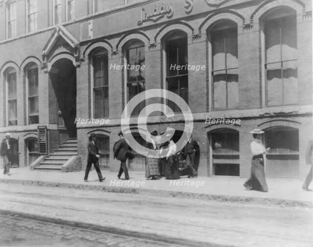 Massachusetts. Lynn. shoe factories, 1895?: sidewalk scene outside Luddy Co., (1895?). Creator: Frances Benjamin Johnston.