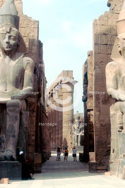 Massive Ancient Egyptian statues and columns at Luxor, Egypt. Artist: Unknown