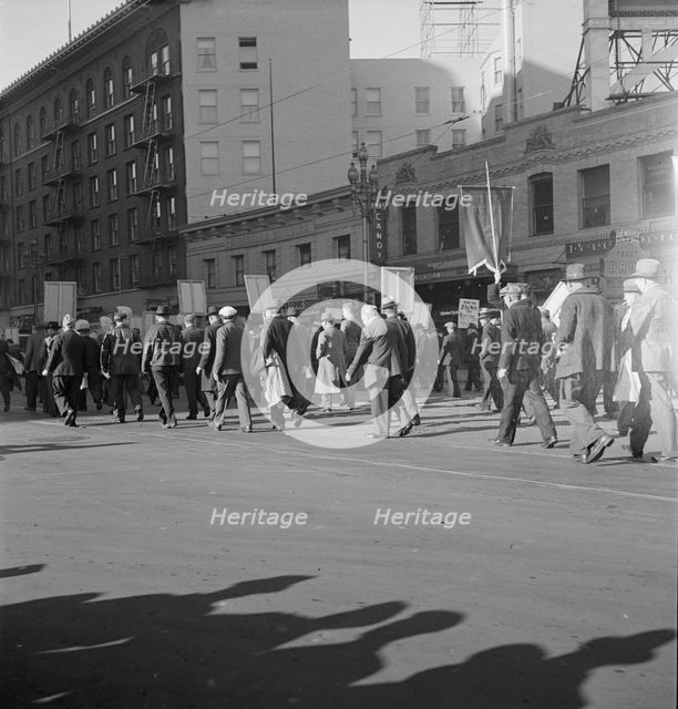 Mass meeting of WPA workers parading up Market Street, San Francisco, California , 1939. Creator: Dorothea Lange.